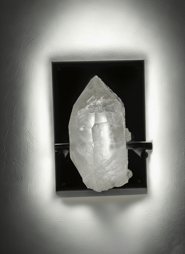 Handcrafted rock crystal wall lamp with natural Brazilian quartz, illuminated front view