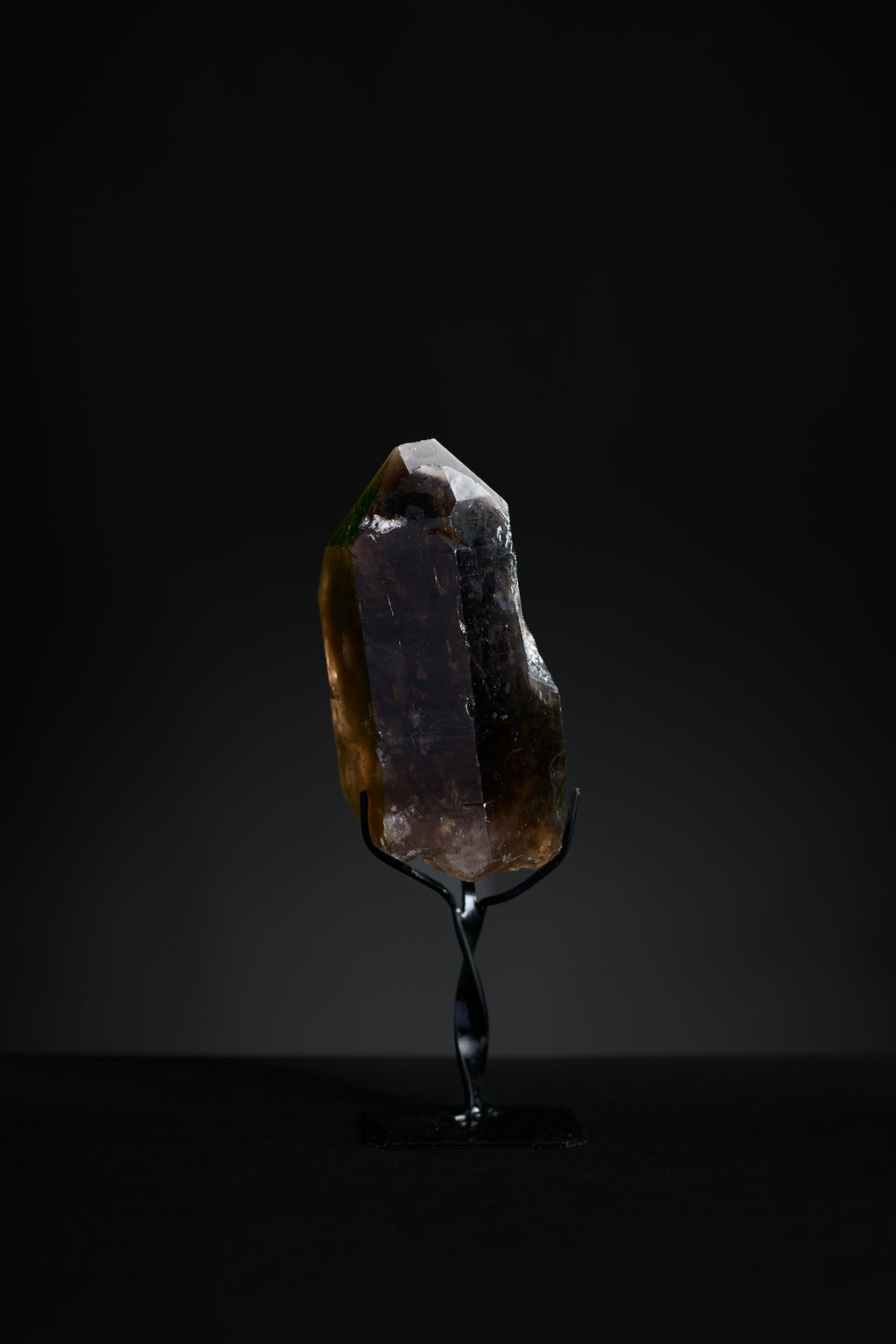 Small smoky quartz crystal point from Brazil with translucent brown clarity, full front view