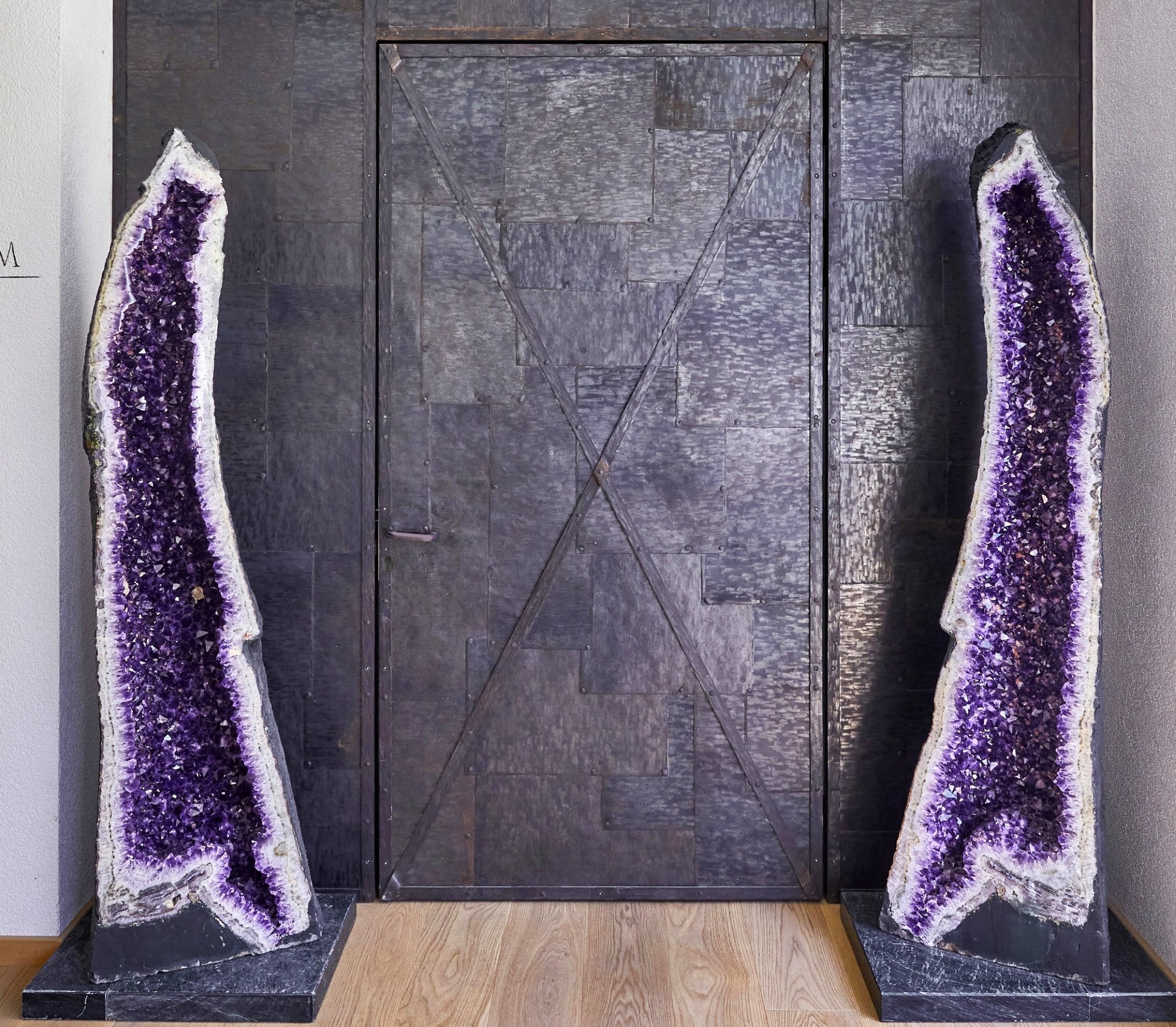 Two tall amethyst geodes.