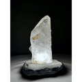 Rock crystal lamp from Brazil with natural yellow hue, illuminated front view